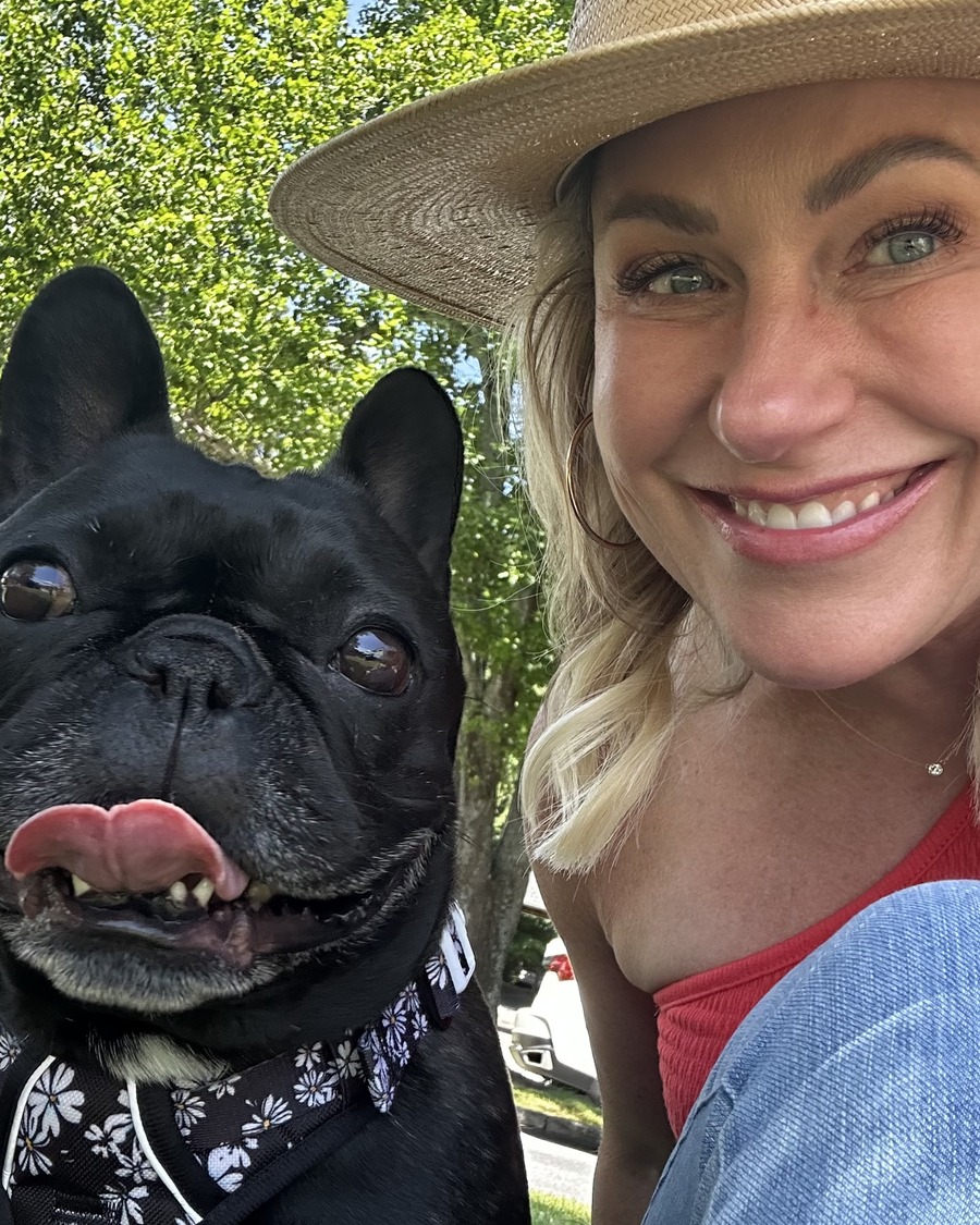 Lindsay and Palmer laughing together on a brewery patio