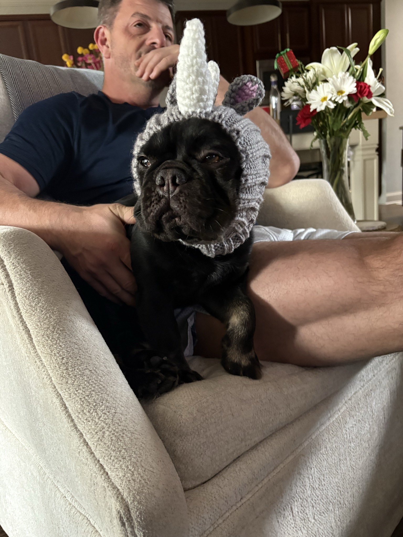 Rosie in a knit unicorn hat